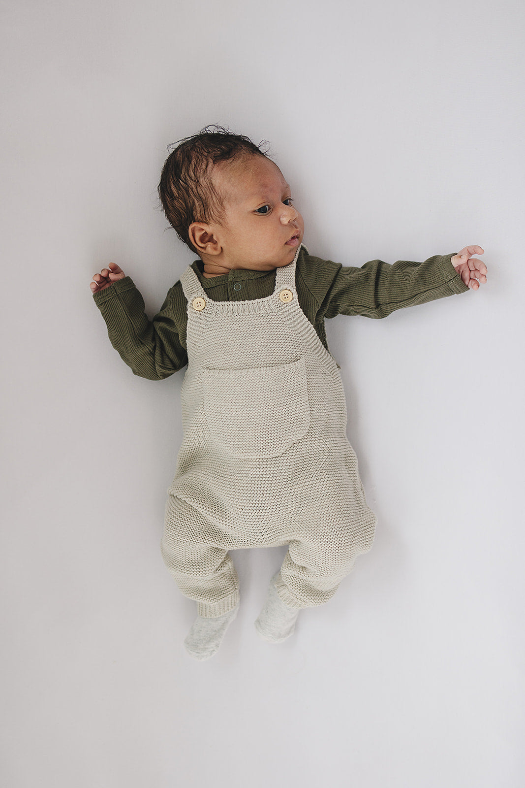 Winter Green Organic Snap Long Sleeve Ribbed Bodysuit shown from a different angle to highlight this bamboo snap bodysuit