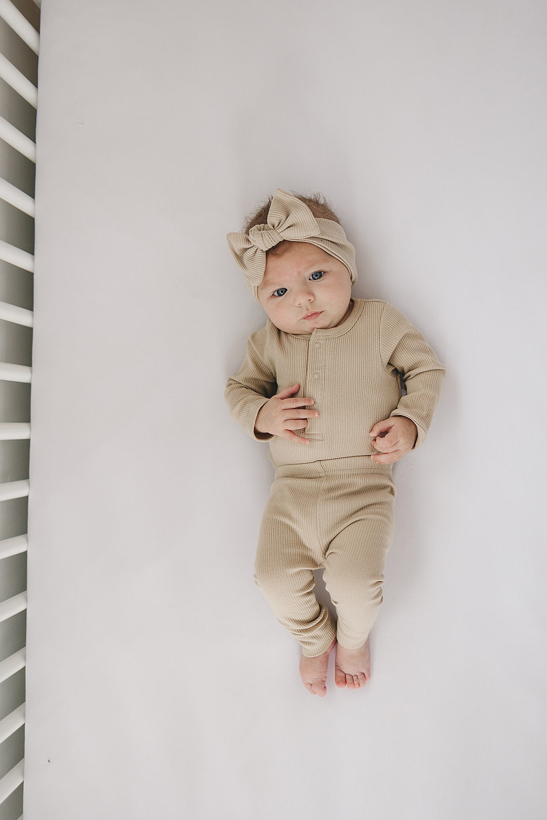 Organic cotton ribbed baby bodysuit, the Oatmeal Organic Snap Long Sleeve Ribbed Bodysuit styled with matching baby leggings.
