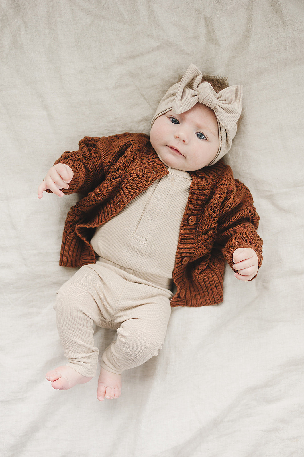 Oatmeal Organic Leggings paired with a matching bodysuit, an organic cotton baby leggings with ribbed waistband.
