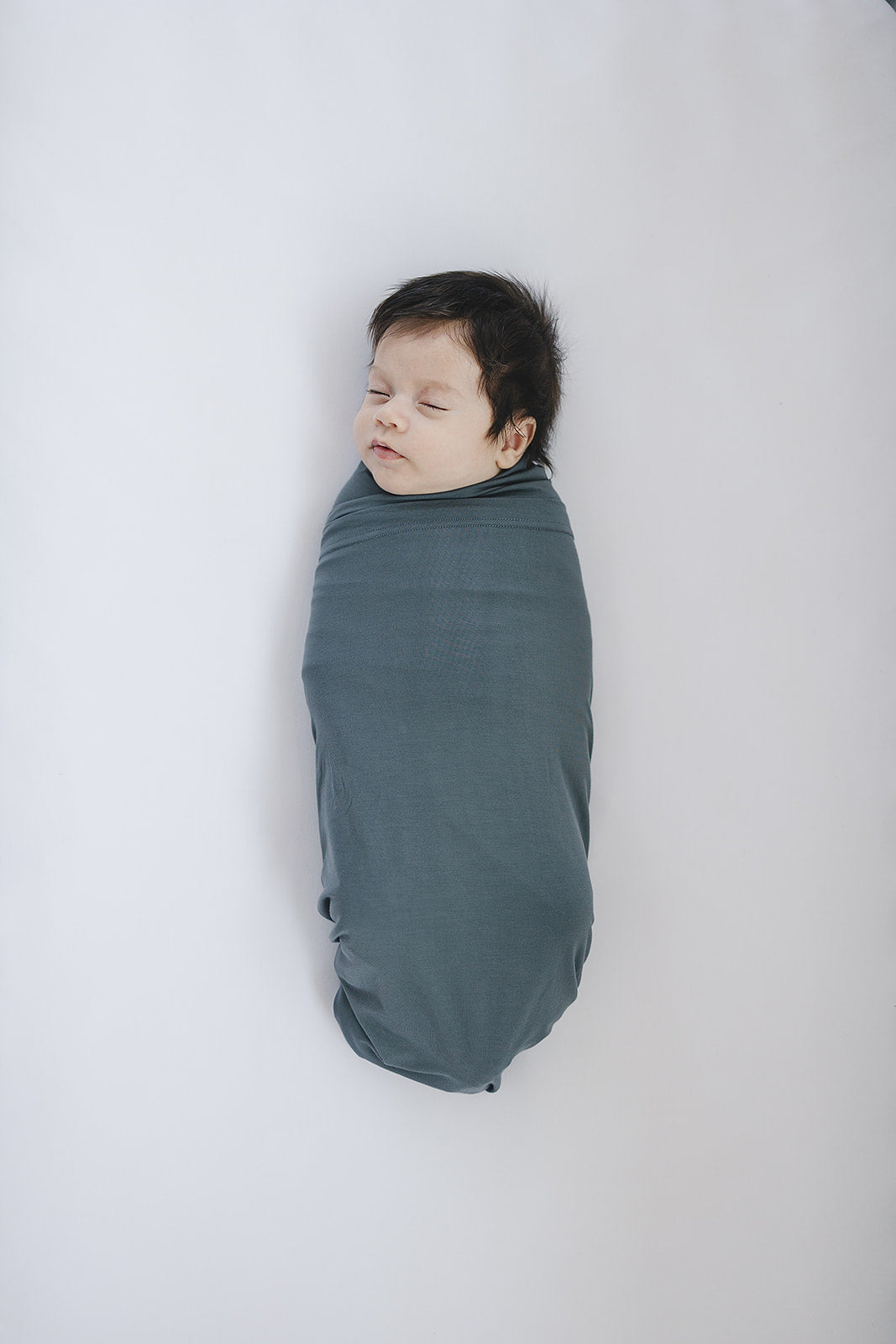 Cuddle your infant in the Mebie Baby Charcoal Bamboo Stretch Swaddle, a gentle baby swaddle wrap.
