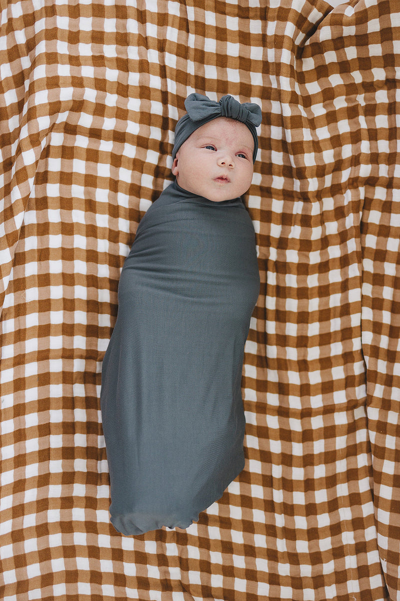 Soft and stretchy, the Mebie Baby Charcoal Bamboo Stretch Swaddle works as one of the best swaddles for babies.