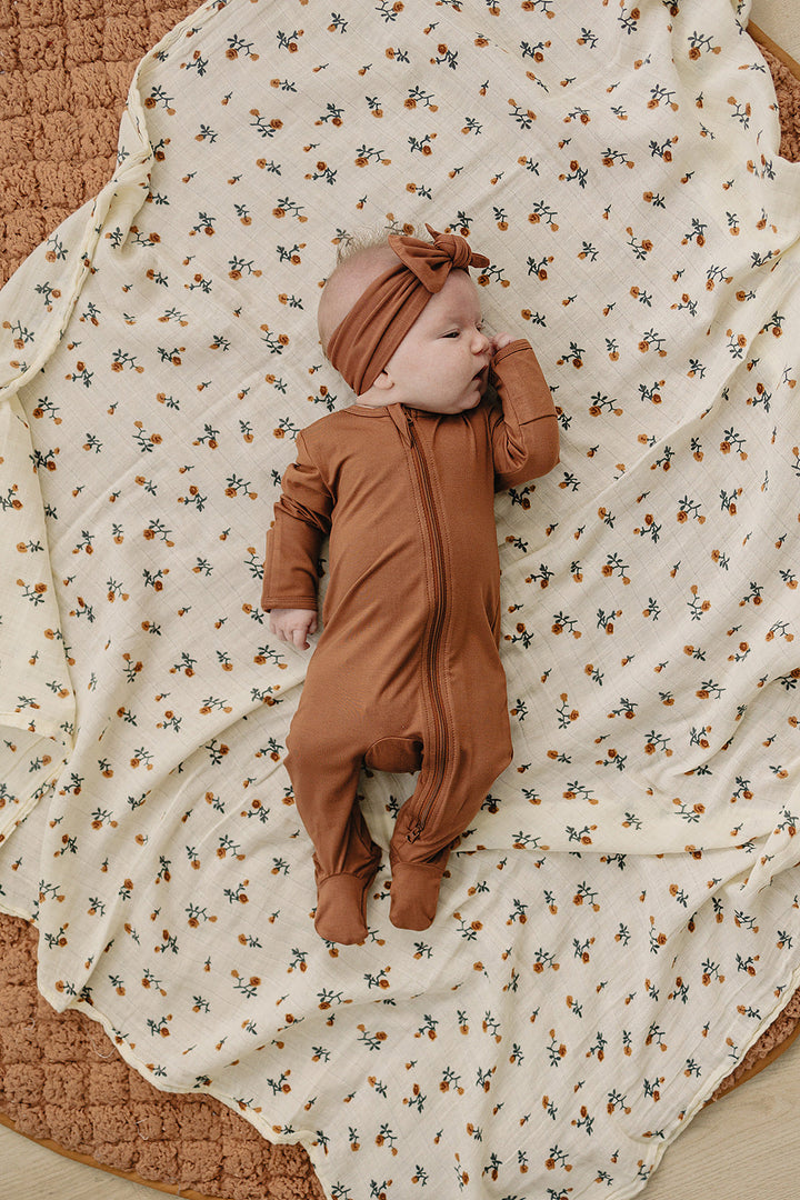 Rust Bamboo Footed Zipper shown from a different angle to highlight this zipper baby pajama