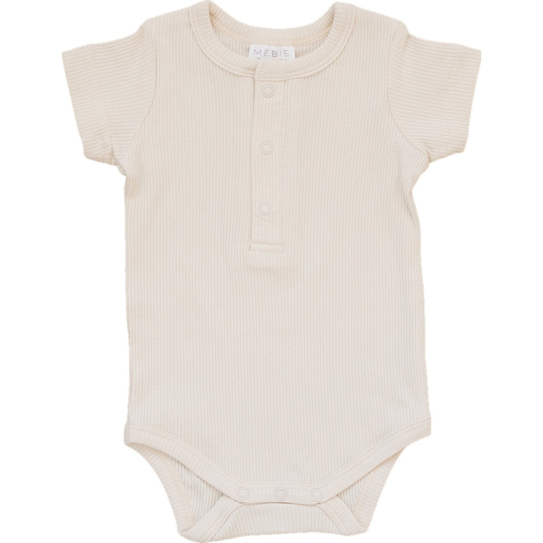 Vanilla Organic Cotton Ribbed Snap Bodysuit by Mebie Baby, worn by a crawling baby.