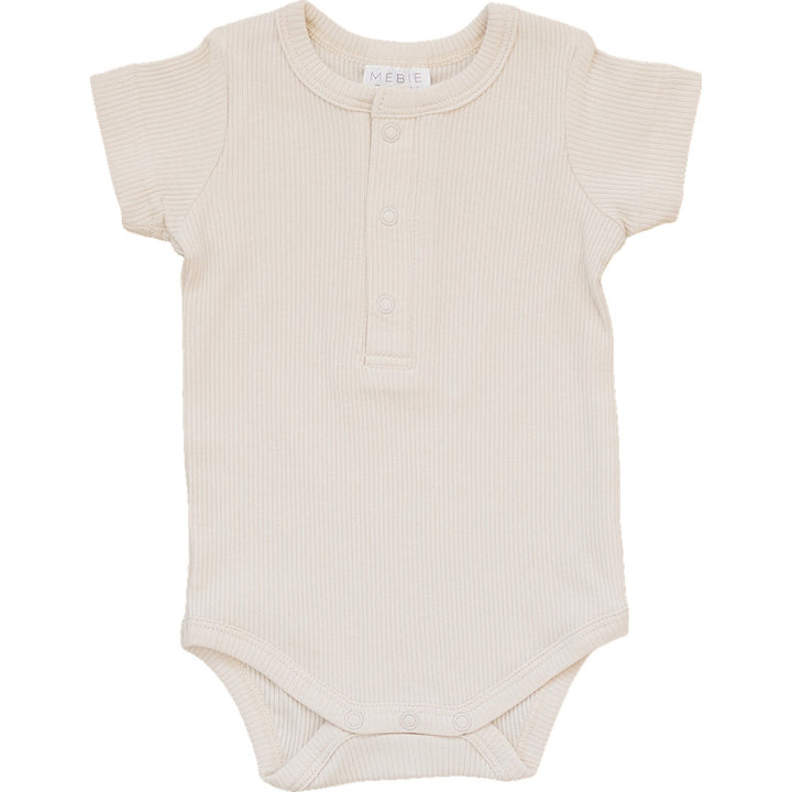 Vanilla Organic Cotton Ribbed Snap Bodysuit by Mebie Baby, worn by a crawling baby.