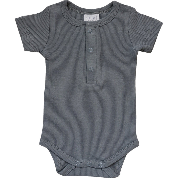 Grey Organic Cotton Ribbed Snap Bodysuit by Mebie Baby, worn by a crawling baby.