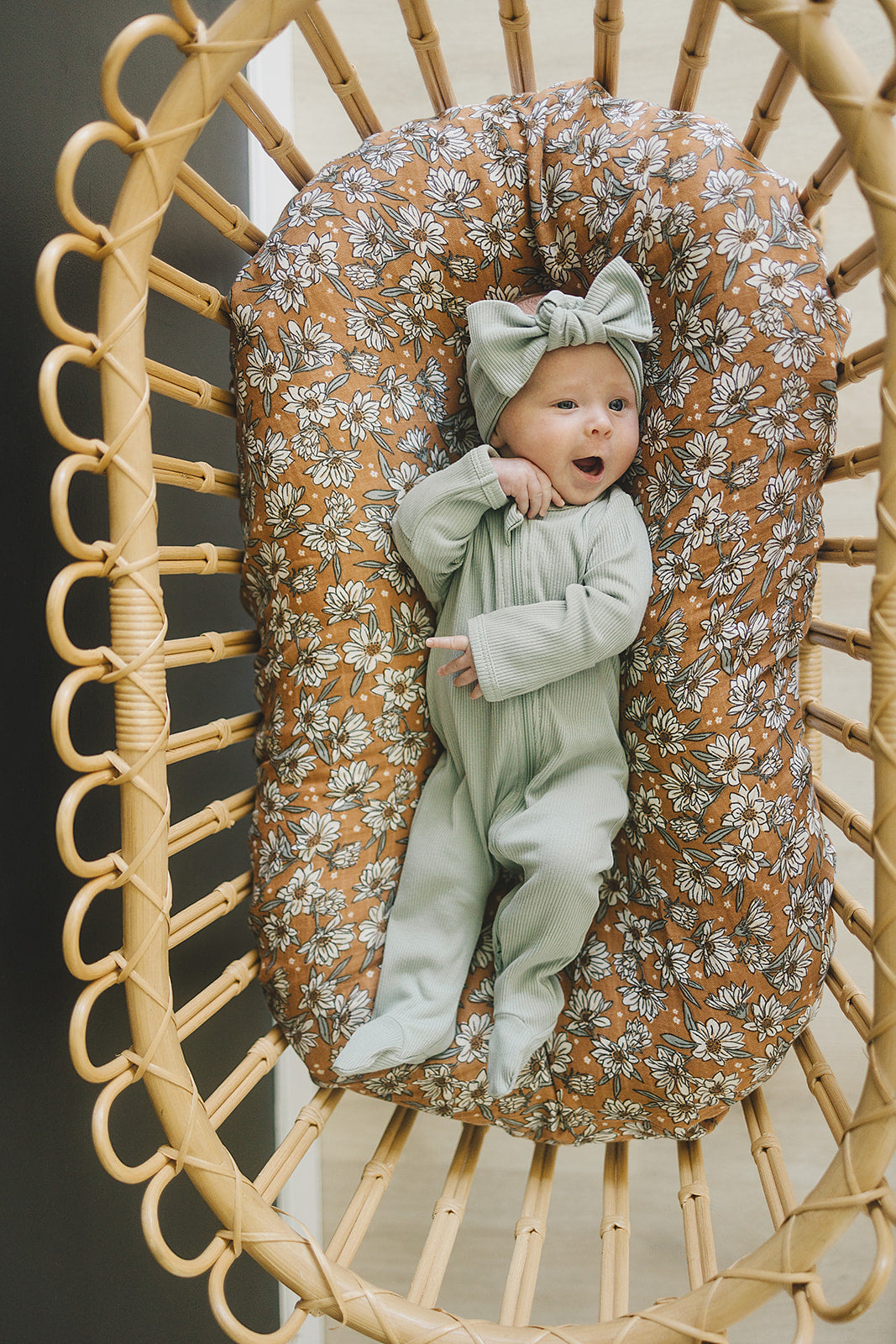 Laid flat to show the ribbed fabric, the Sage Organic Cotton Ribbed Zipper from Mebie Baby.