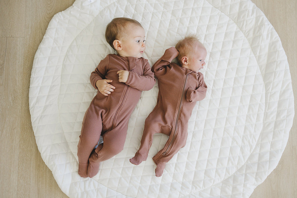 Babies in the one piece footed pajamas