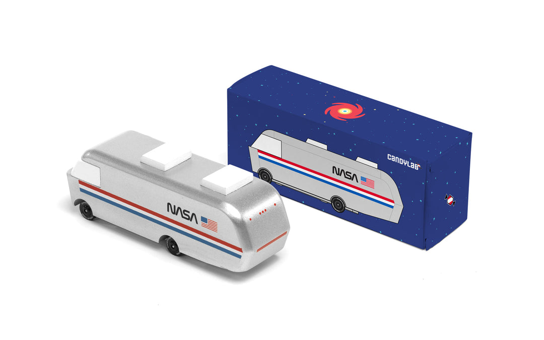 A packaged Plantoys NASA Astrovan displayed neatly, highlighting a collectible wooden toy car style.