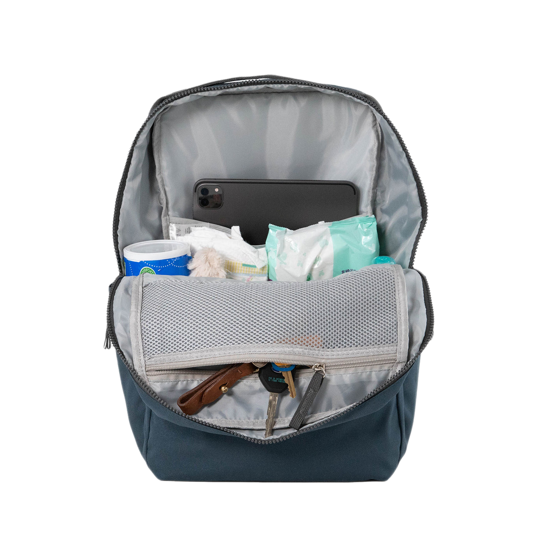 Side view of the Little Unicorn Red Rovr Roo Backpack - Navy showing functional pockets for kids school backpacks.