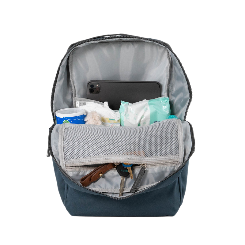 Side view of the Little Unicorn Red Rovr Roo Backpack - Navy showing functional pockets for kids school backpacks.