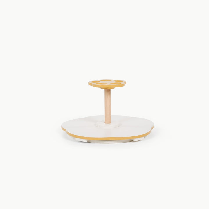 Mustard colored Sit and Spin toy by Gathre, shown alone from the side