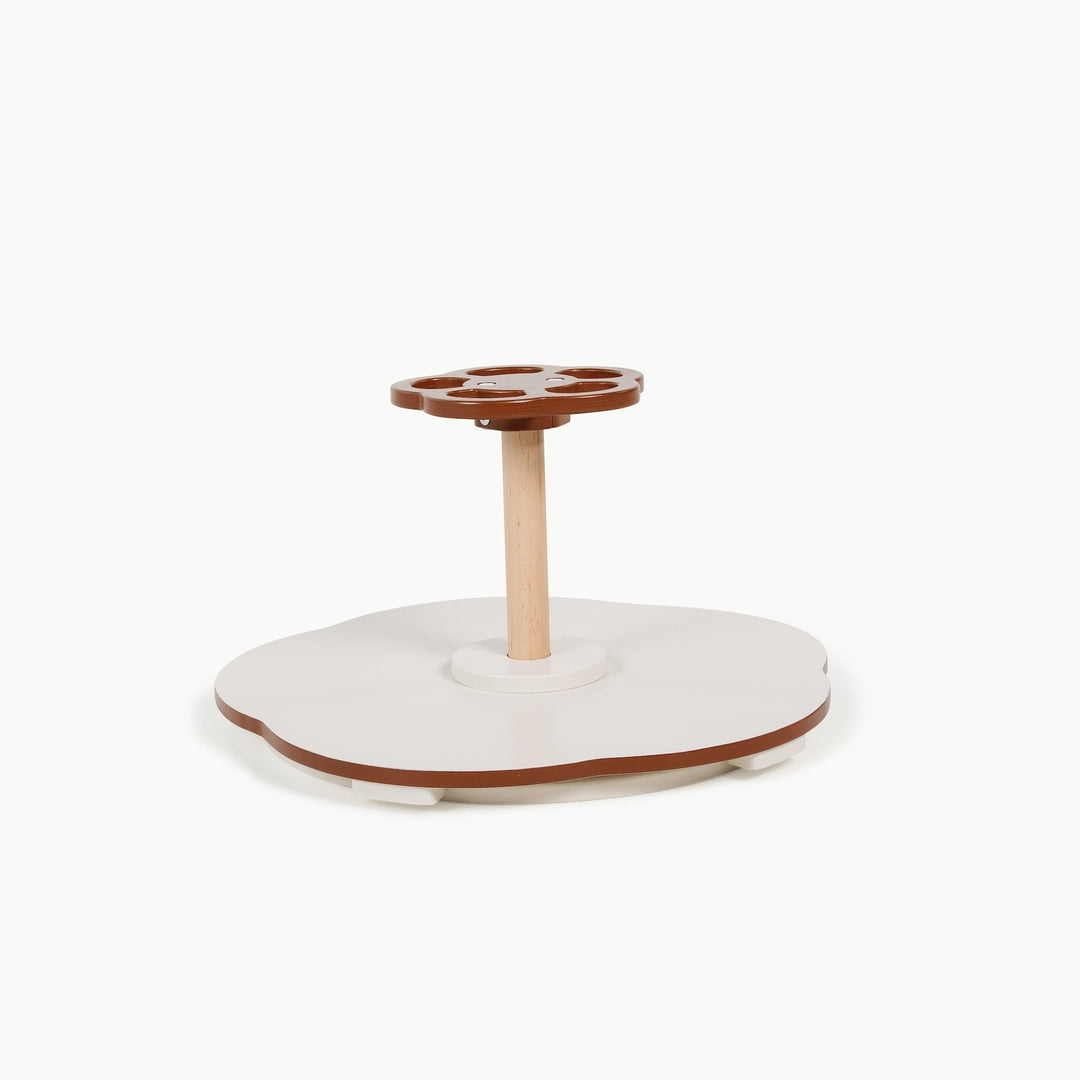 Rust colored Sit and Spin toy from Gathre, photographed against a plain background