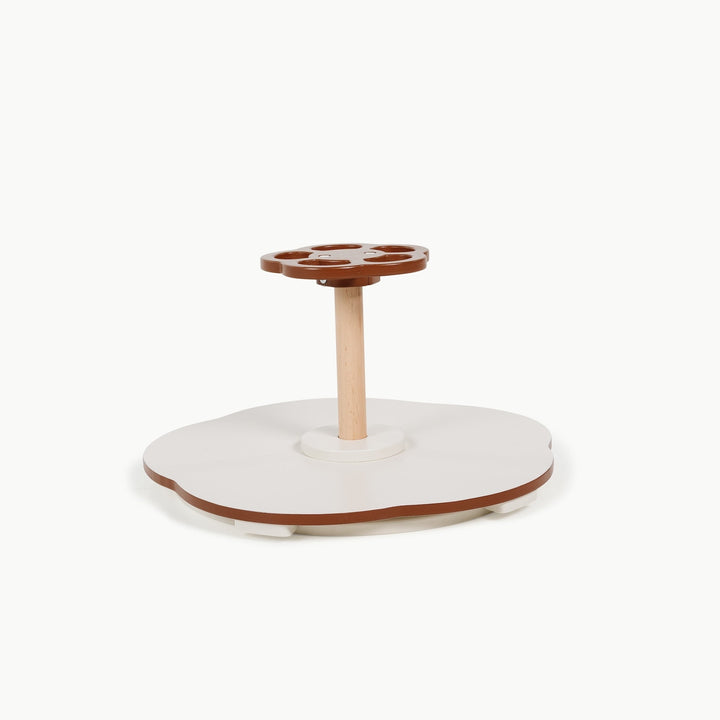 Rust colored Sit and Spin toy from Gathre, photographed against a plain background