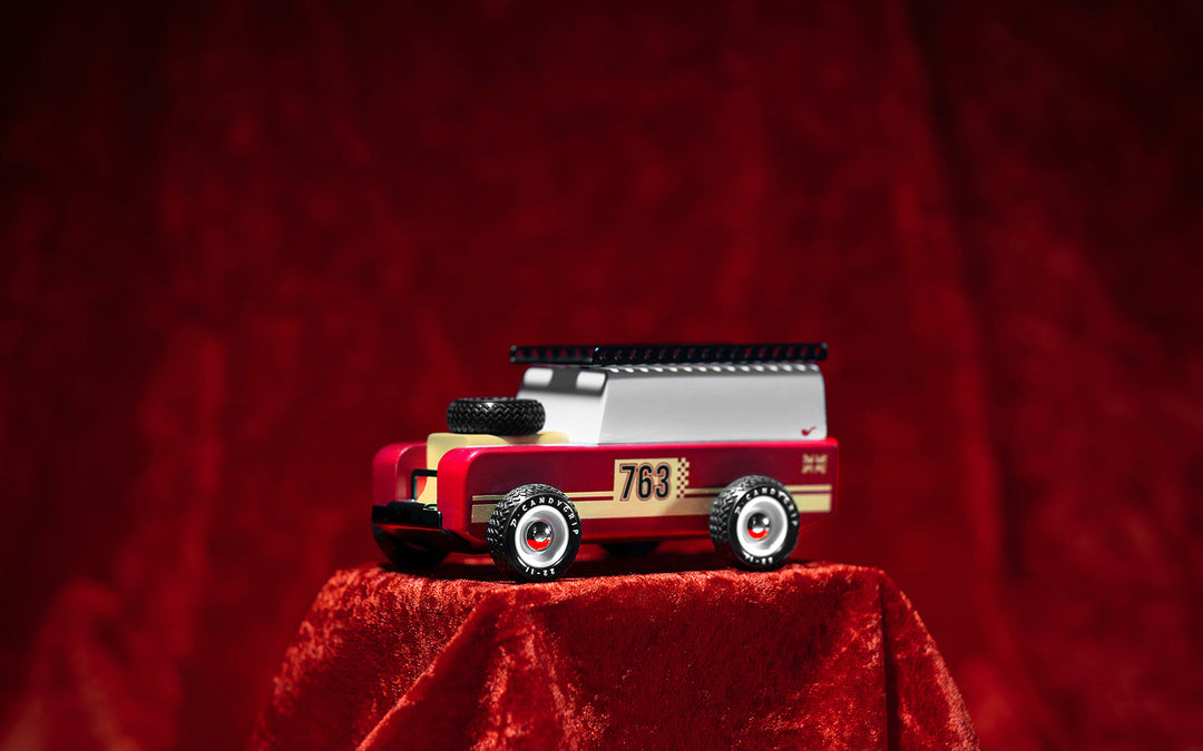The Plantoys Drifter Nigel in a velvet finish sits stylishly on display, adding charm to any toddler toy car collection.
