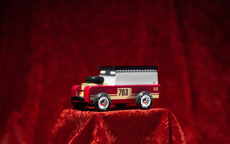 The Plantoys Drifter Nigel in a velvet finish sits stylishly on display, adding charm to any toddler toy car collection.