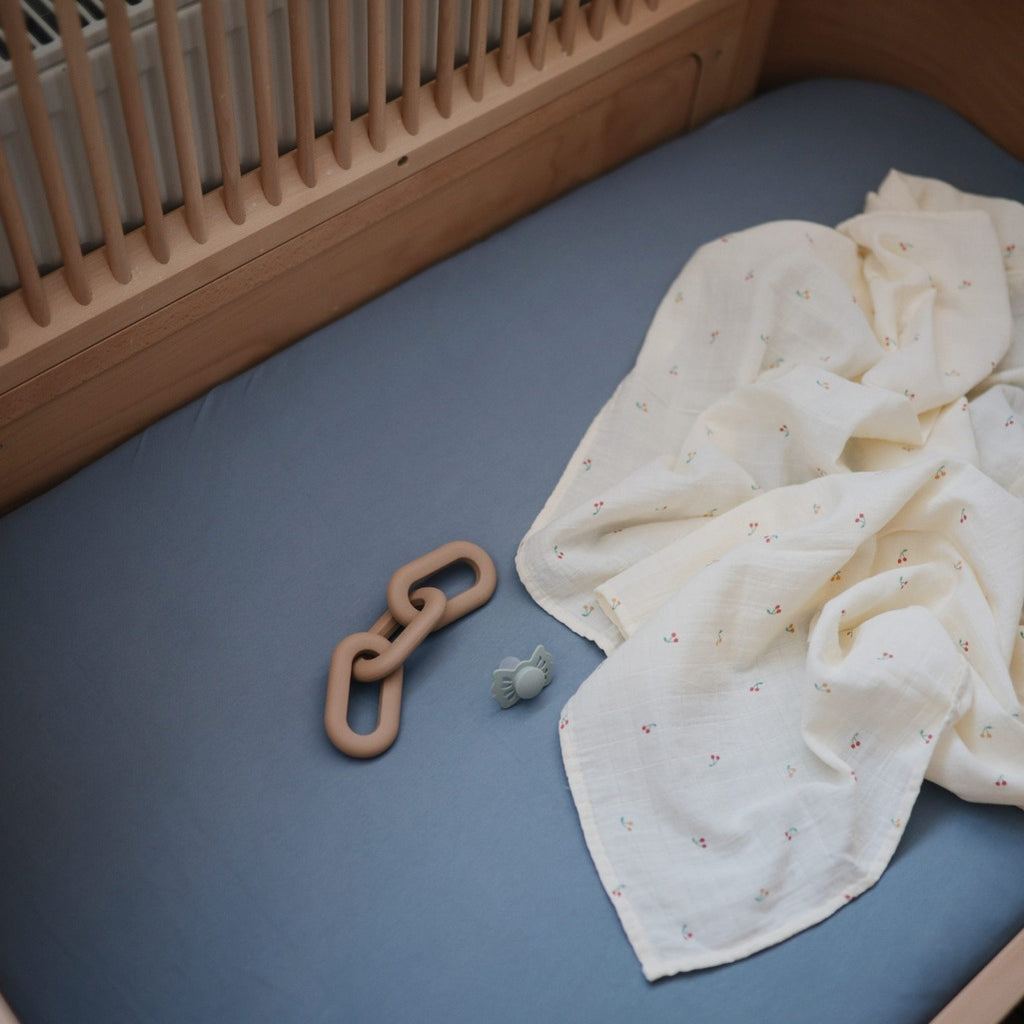 crib with teether and swaddle. 