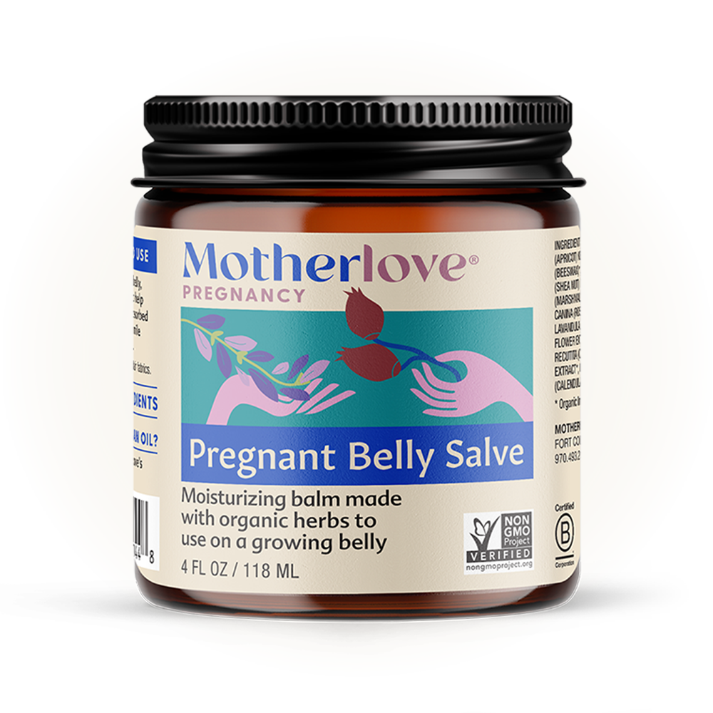 Soft light illuminates Motherlove Pregnant Belly Salve jar, crafted with organic botanicals for nourishing pregnancy skincare.
