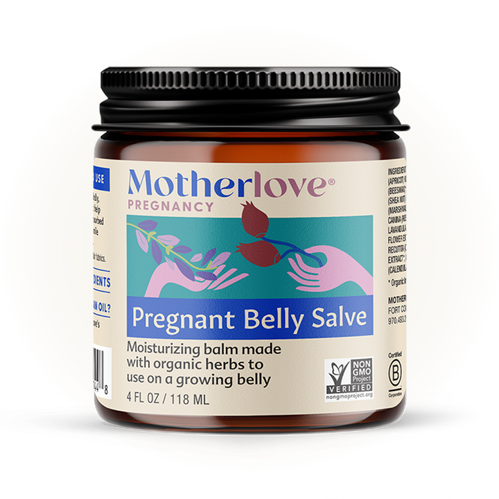 Soft light illuminates Motherlove Pregnant Belly Salve jar, crafted with organic botanicals for nourishing pregnancy skincare.