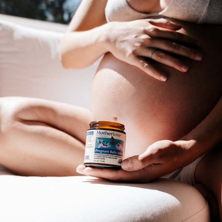 Close-up of Motherlove Pregnant Belly Salve, a smooth and hydrating pregnancy stretch mark cream for daily belly care.