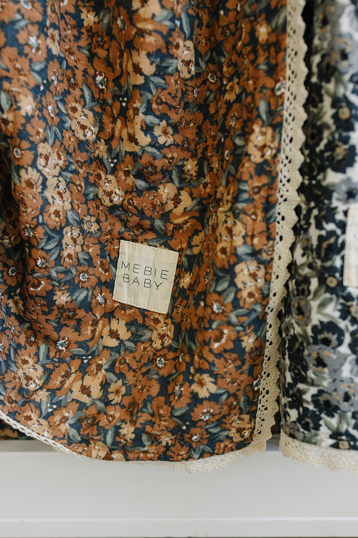 Lightweight and airy, the Mebie Baby Venetian Floral + Autumn Bloom Lace Muslin Quilt is great for muslin blankets baby.