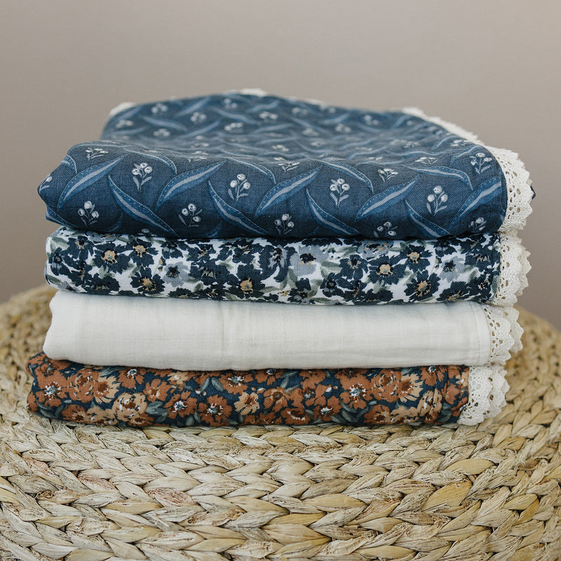 Use the Mebie Baby Navy Berry + Cream Berry Lace Muslin Quilt as a soft muslin quilt for everyday snuggles.