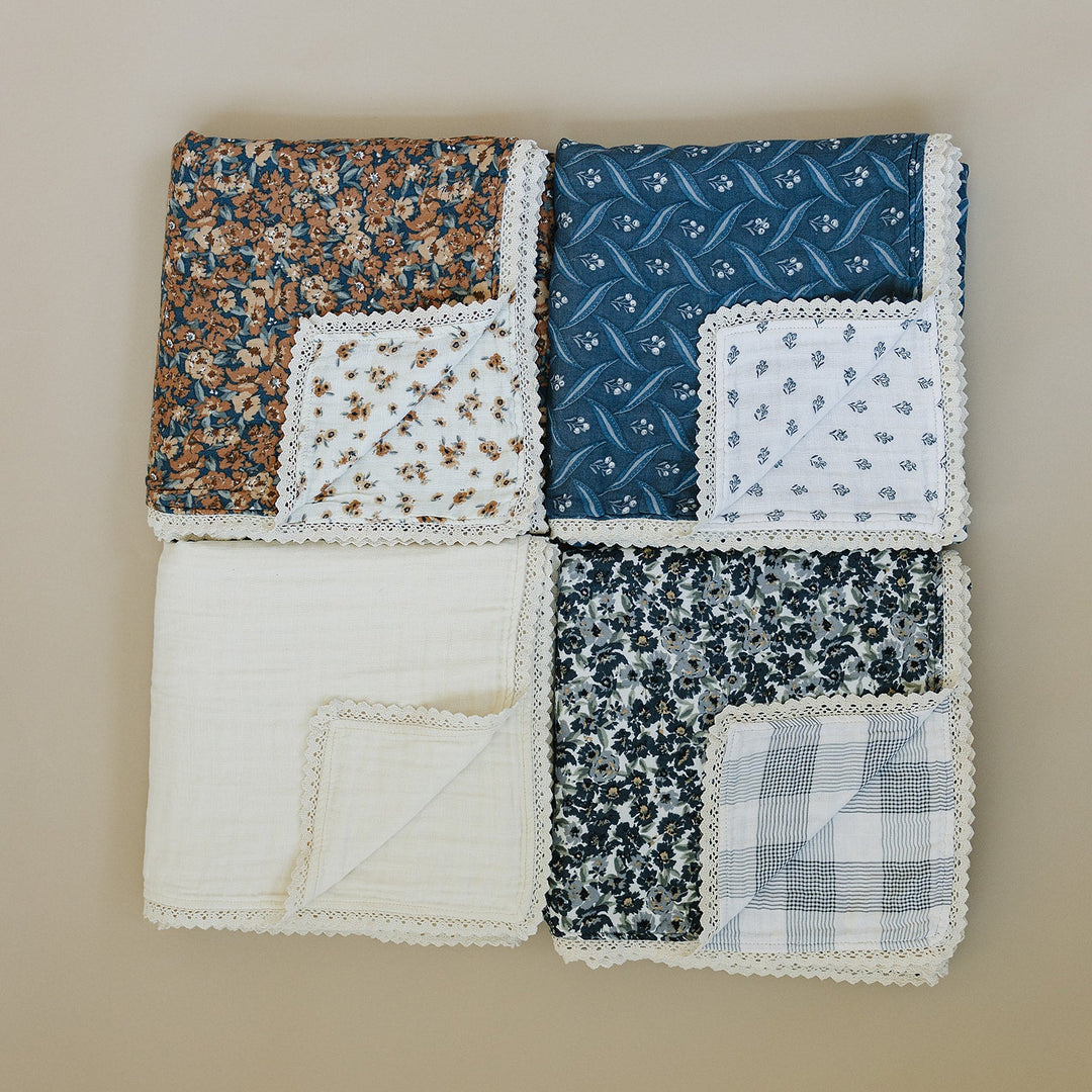 Snuggle time made easy with the Mebie Baby Cream Lace Muslin Quilt, a breathable muslin quilt for infants.