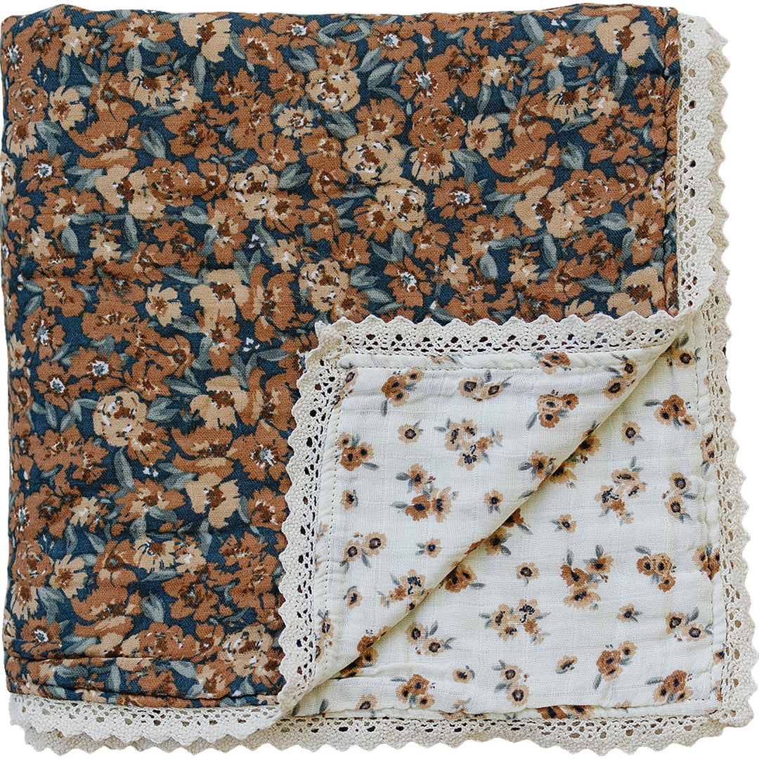 Snuggle your baby in the Mebie Baby Venetian Floral + Autumn Bloom Lace Muslin Quilt, a soft baby blanket.