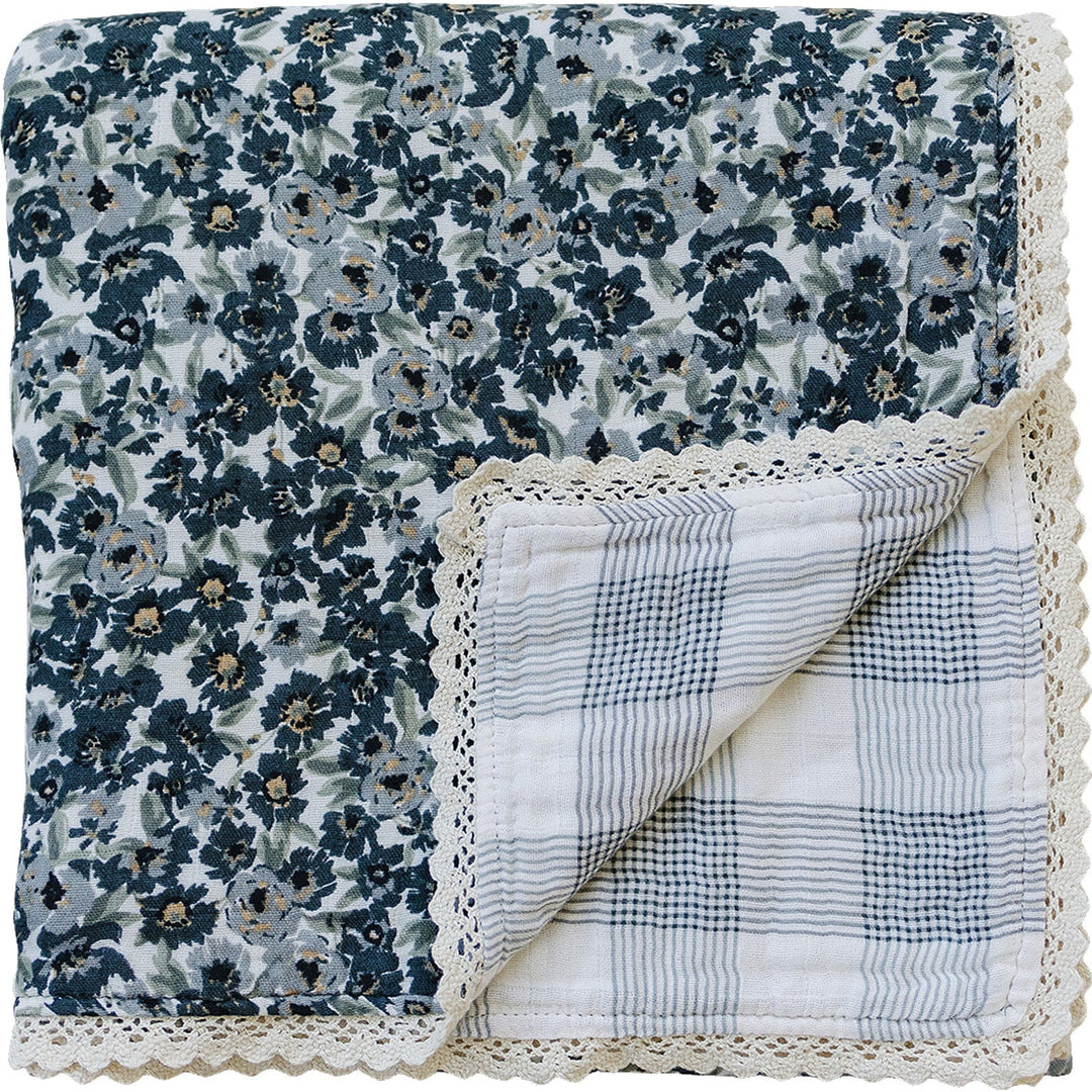 Soft and cozy, the Liberty Floral + Coastal Plaid Lace Muslin Quilt by Mebie Baby is a gentle muslin baby blanket.