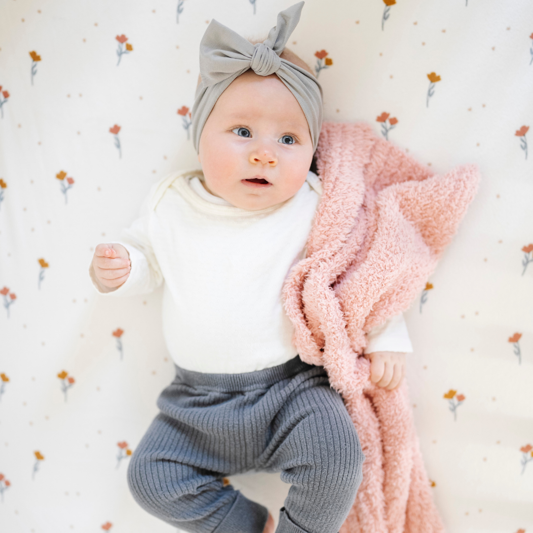 Gentle tones and cloud-like texture make the Saranoni BAMBONI¨ Mini Blanket in Peach the perfect baby girl blanket.