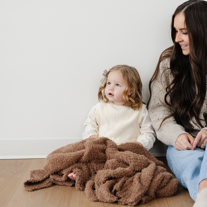 Cuddle time feels extra special with the Saranoni BAMBONI¨ Receiving Blanket in Pecan, crafted for soft baby blankets.