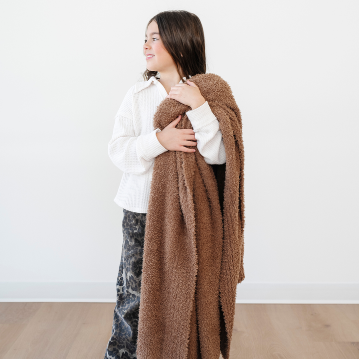 Cuddle time is perfect with the Pecan Saranoni BAMBONI¨ Toddler Blanket, cozy as baby girl blankets.