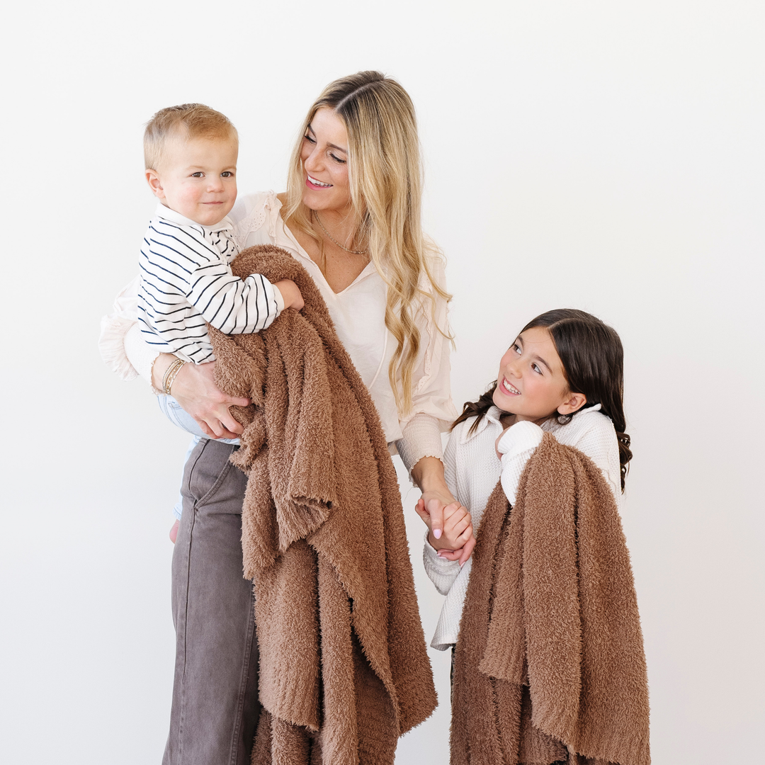 The Pecan BAMBONI¨ Toddler Blanket by Saranoni keeps toddlers warm and comfy as baby blankets.