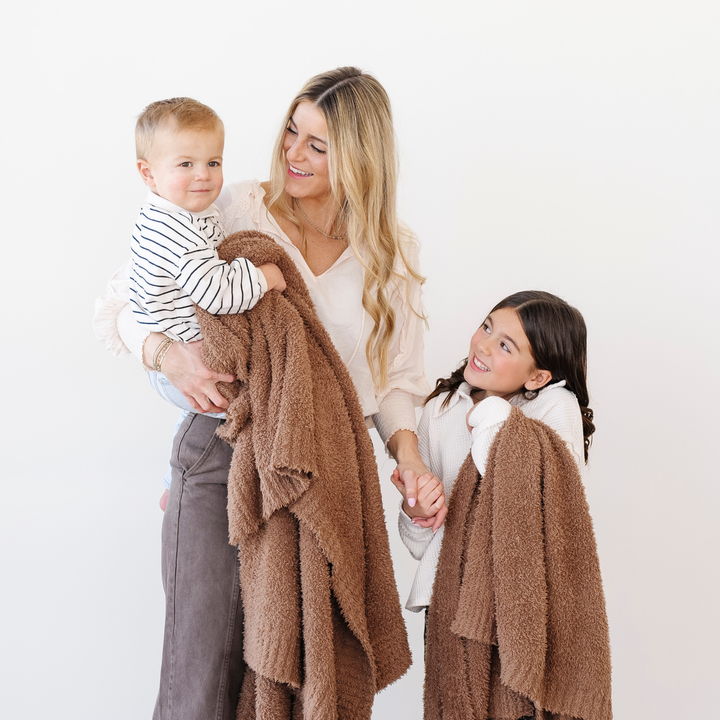 The Pecan BAMBONI¨ Toddler Blanket by Saranoni keeps toddlers warm and comfy as baby blankets.