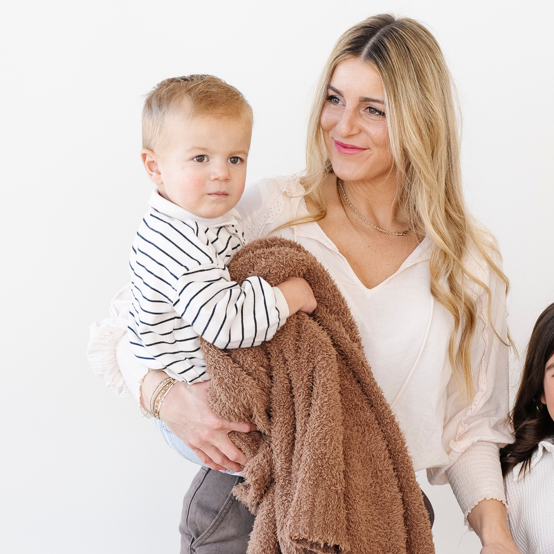Wrap toddlers in Pecan Saranoni BAMBONI¨ Toddler Blanket, soft and plush, ideal as baby boy blankets.