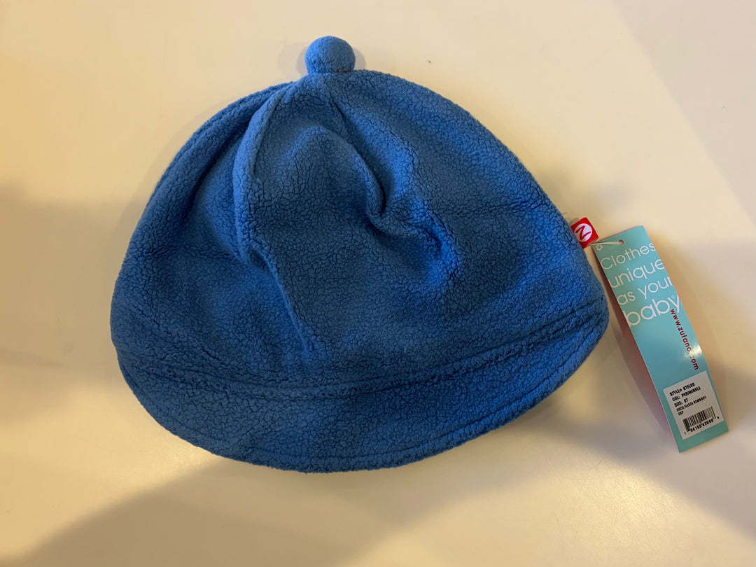 Periwinkle blue Zutano Cozie Fleece Newsboy Cap, an open box toddler fleece hat with its original tag attached