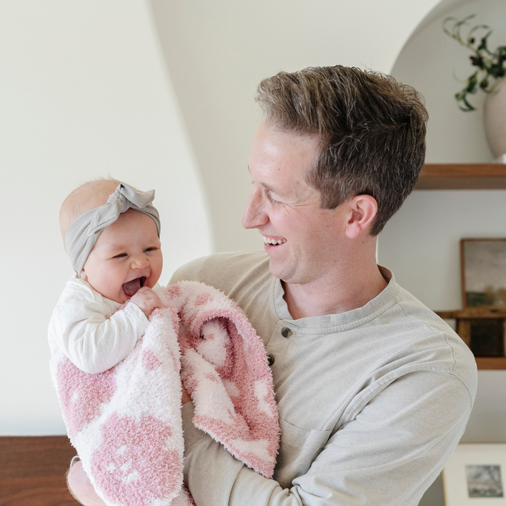 Delicate and plush, the Petal Saranoni Double-Layer BAMBONI¨ Mini Blanket offers sweet comfort, making it a cherished baby girl blanket.