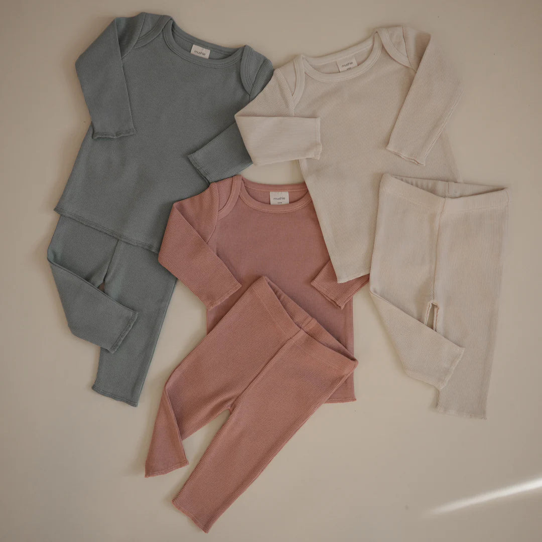 picture showing three matching clothing set for baby in natural colors for coordinated baby outfit 