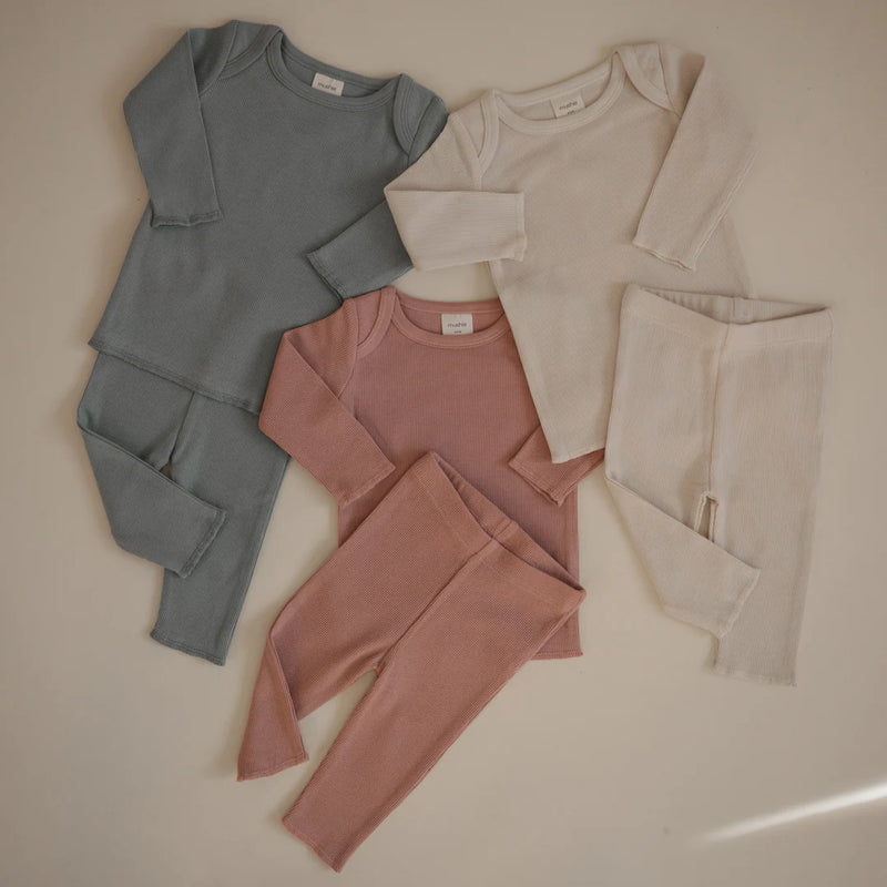 picture showing three matching clothing set for baby in natural colors for coordinated baby outfit 