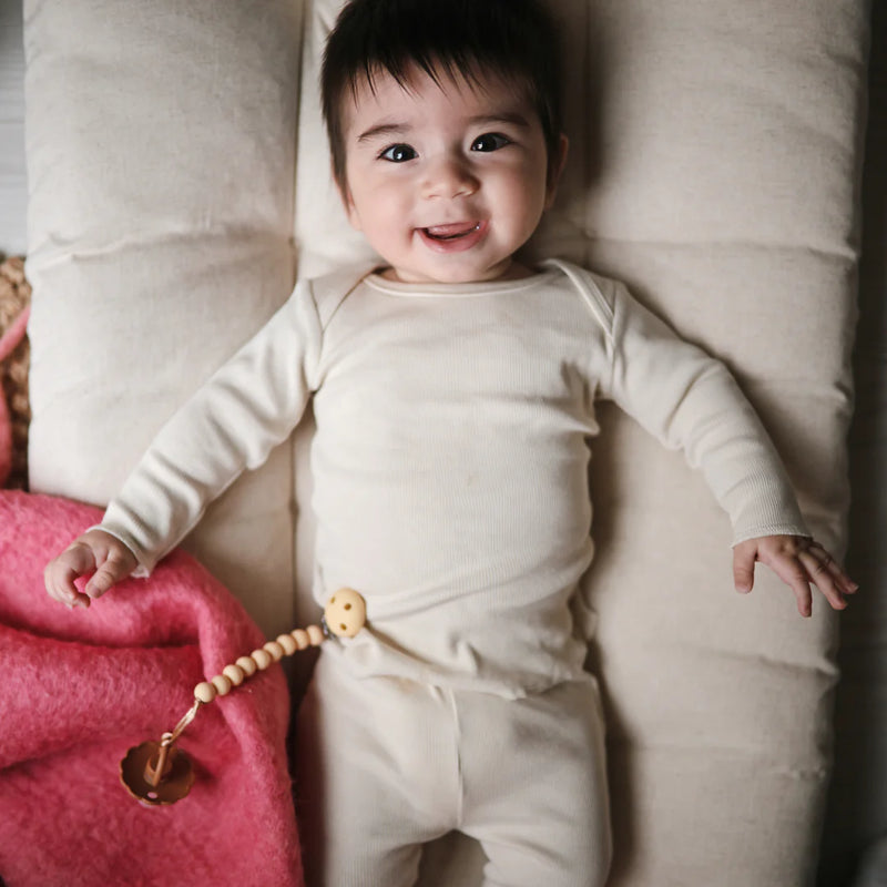 baby wearing natural waffle knit waffle kit lightweight matching shirt and pants 