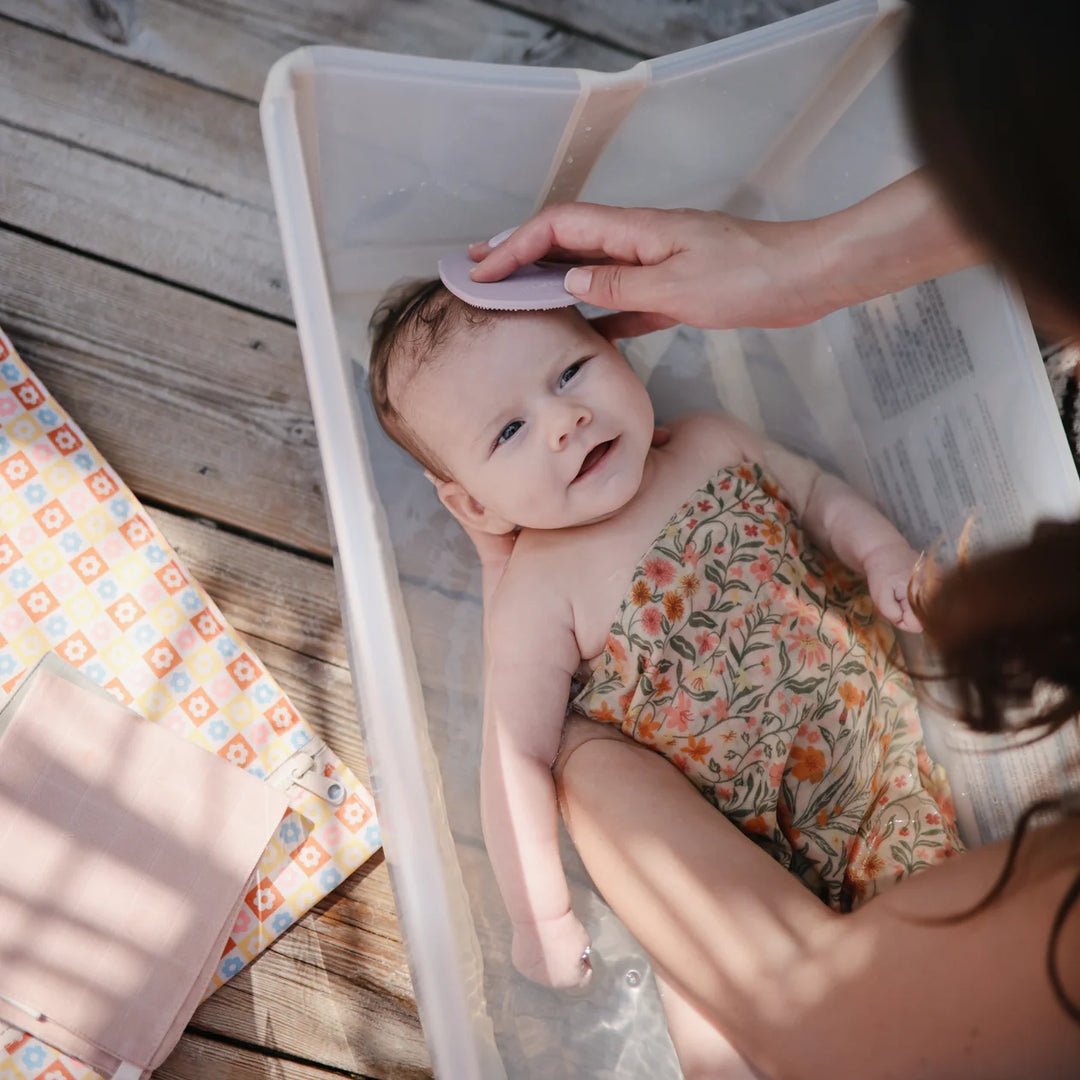 Mushie organic cotton washcloths in use - 5-pack muslin baby washcloths for bath time and everyday messes