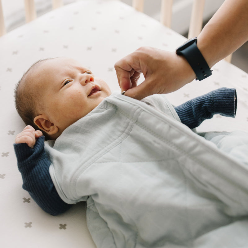 Detail view of Little Unicorn Cotton Muslin Quilted Sleep Bag - Sea Salt, quilted muslin fabric for a soft sleep bag baby.