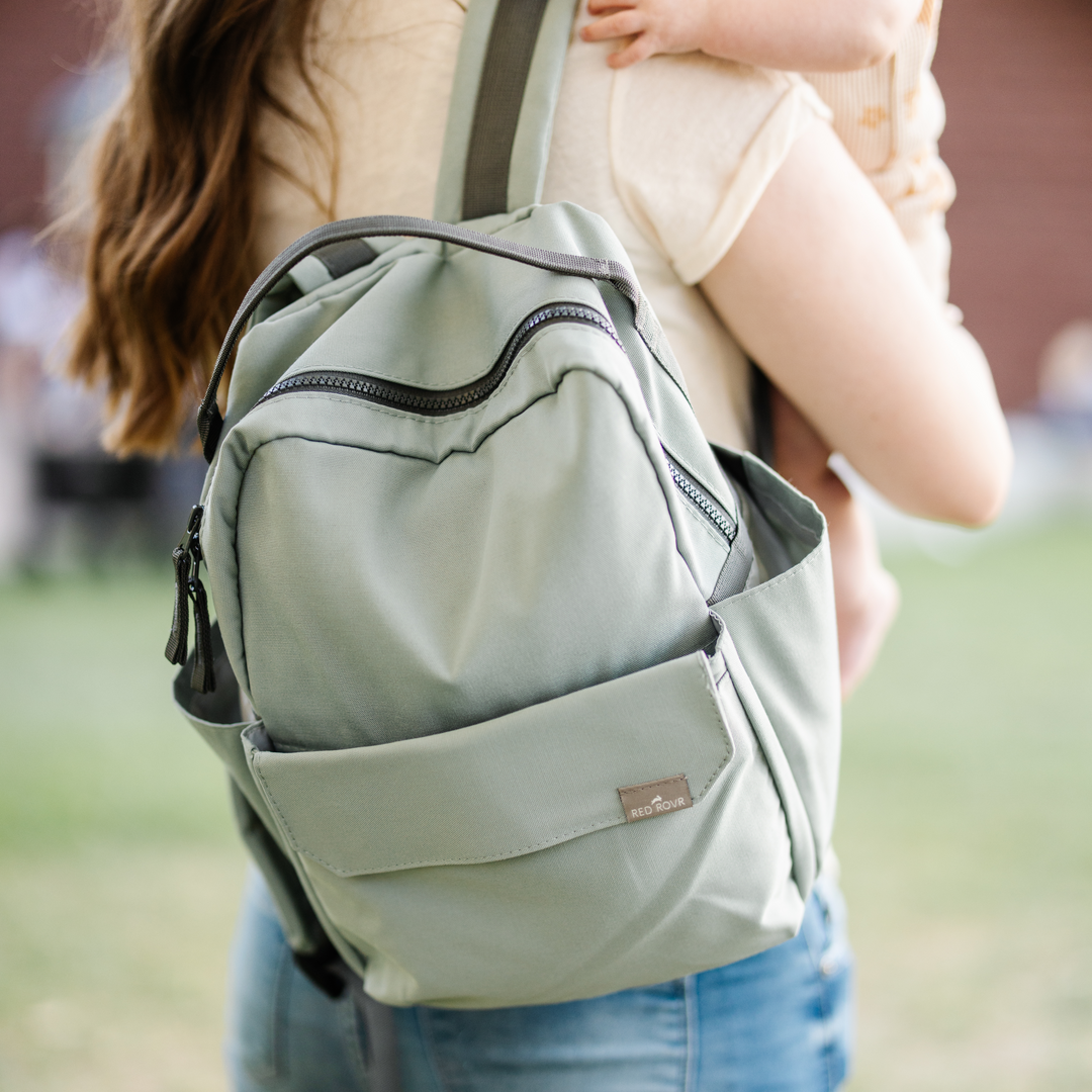 Back view of the Little Unicorn Red Rovr Mini Roo Backpack - Sage, featuring padded straps for comfort and little kids backpack use.