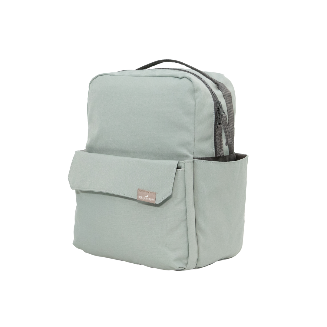 Top handle detail of the Little Unicorn Red Rovr Mini Roo Backpack - Sage, perfect for an easy-to-carry kid backpack.