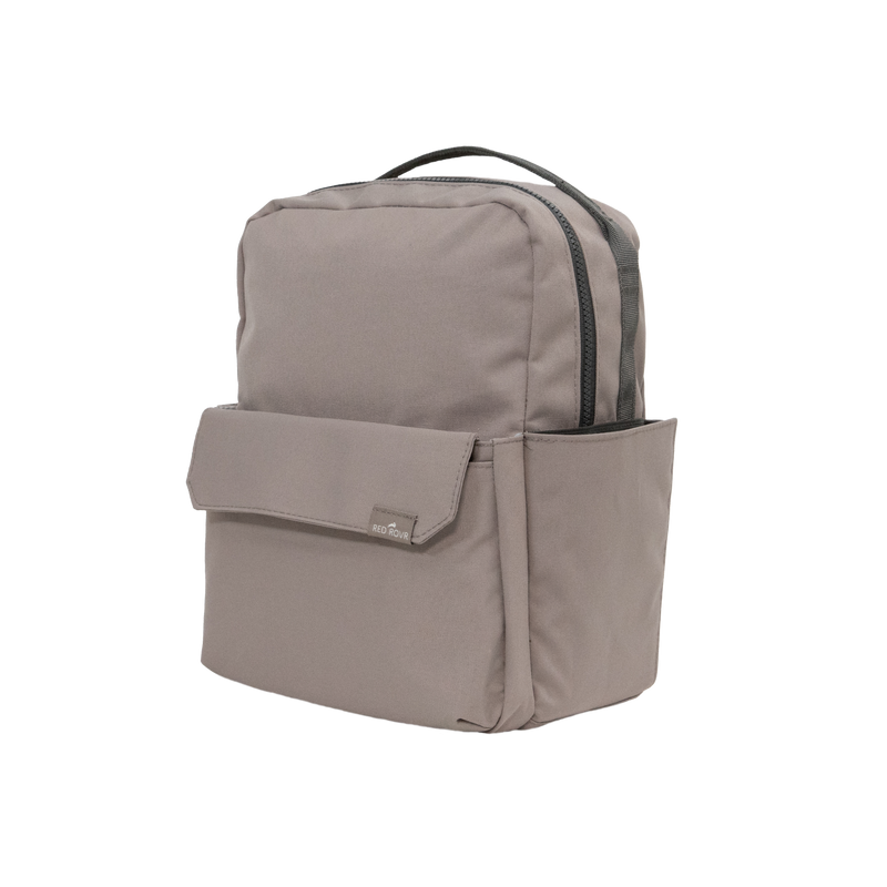 Made for young explorers, the Little Unicorn Red Rovr Mini Roo Backpack in Truffle is a functional kid backpack.