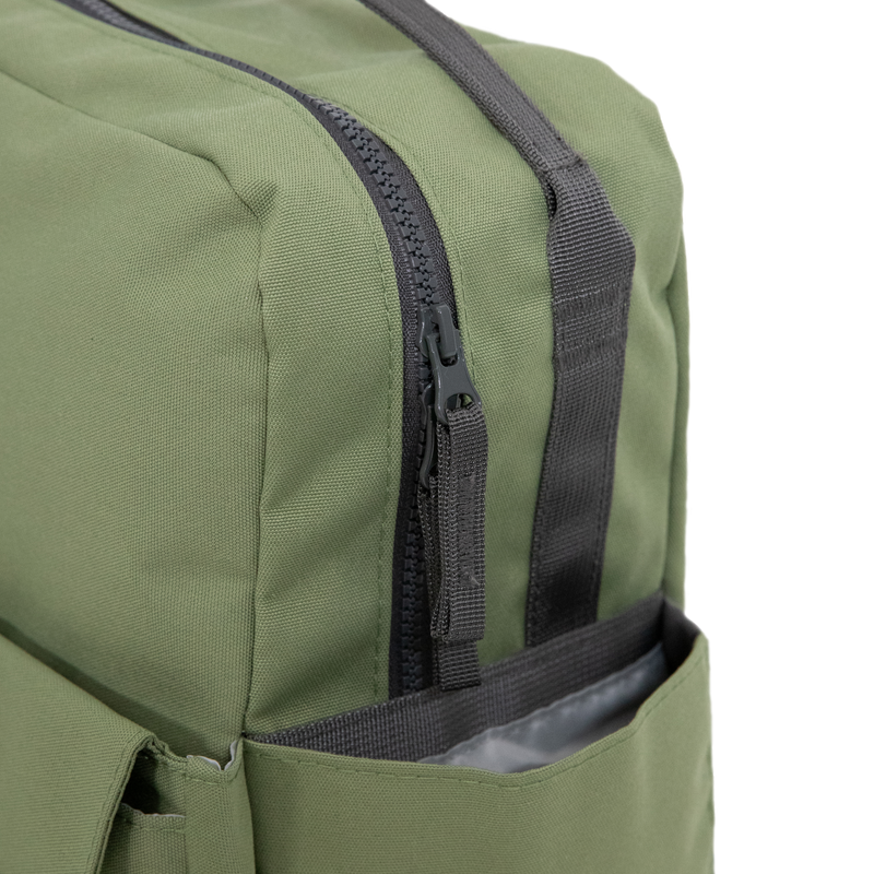 Side angle of the Little Unicorn Red Rovr Mini Roo Backpack in Moss, ideal for families seeking the best kids backpacks.