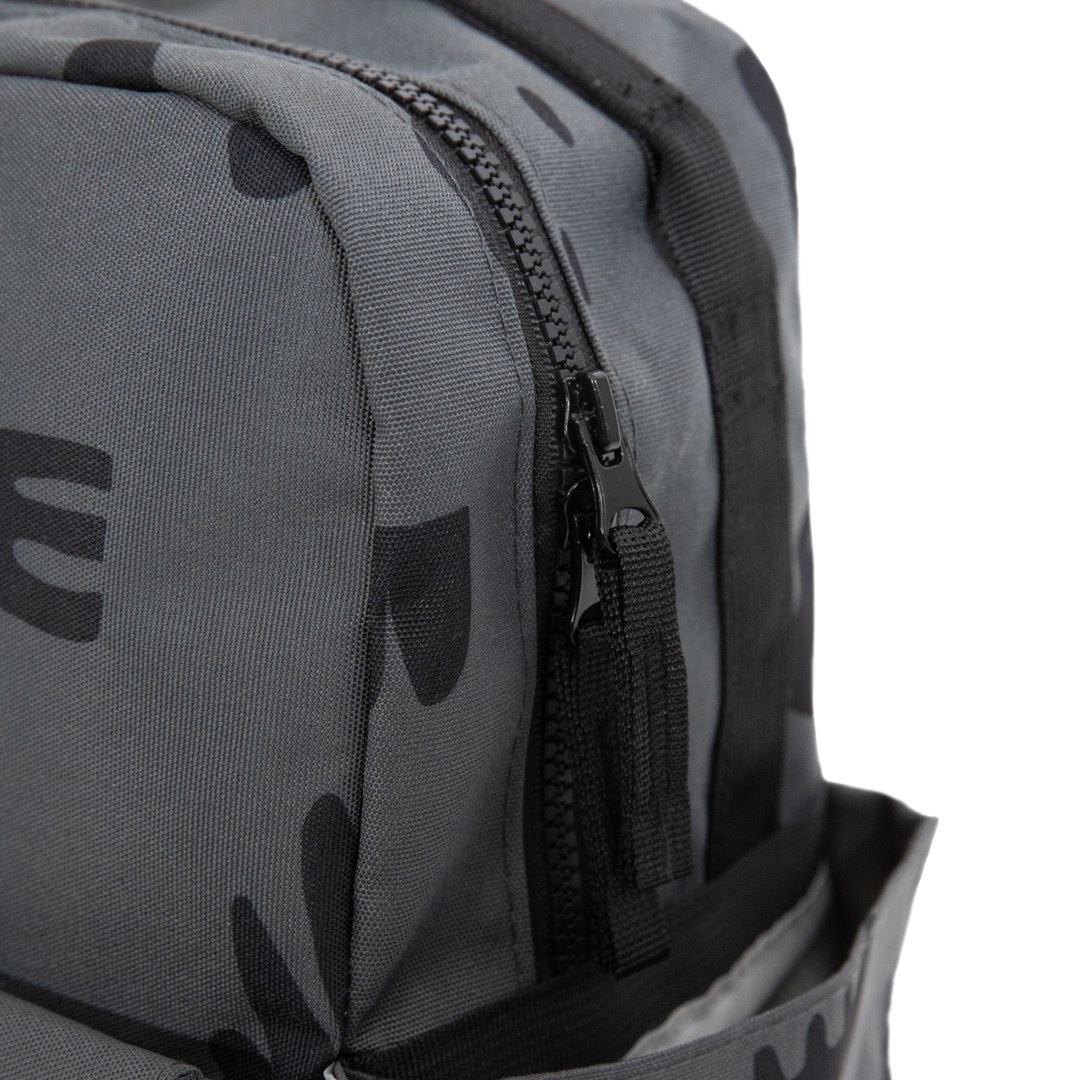 Little Unicorn Red Rovr Mini Roo Backpack - Charcoal Doodle shown with zipper detail, a durable and stylish kids school backpacks option.