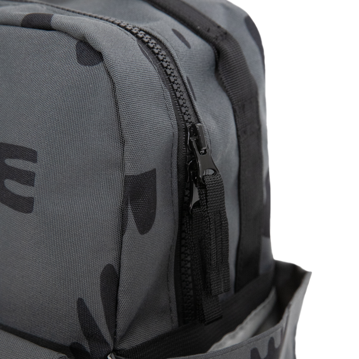 Little Unicorn Red Rovr Mini Roo Backpack - Charcoal Doodle shown with zipper detail, a durable and stylish kids school backpacks option.