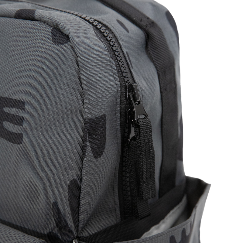 Little Unicorn Red Rovr Mini Roo Backpack - Charcoal Doodle shown with zipper detail, a durable and stylish kids school backpacks option.