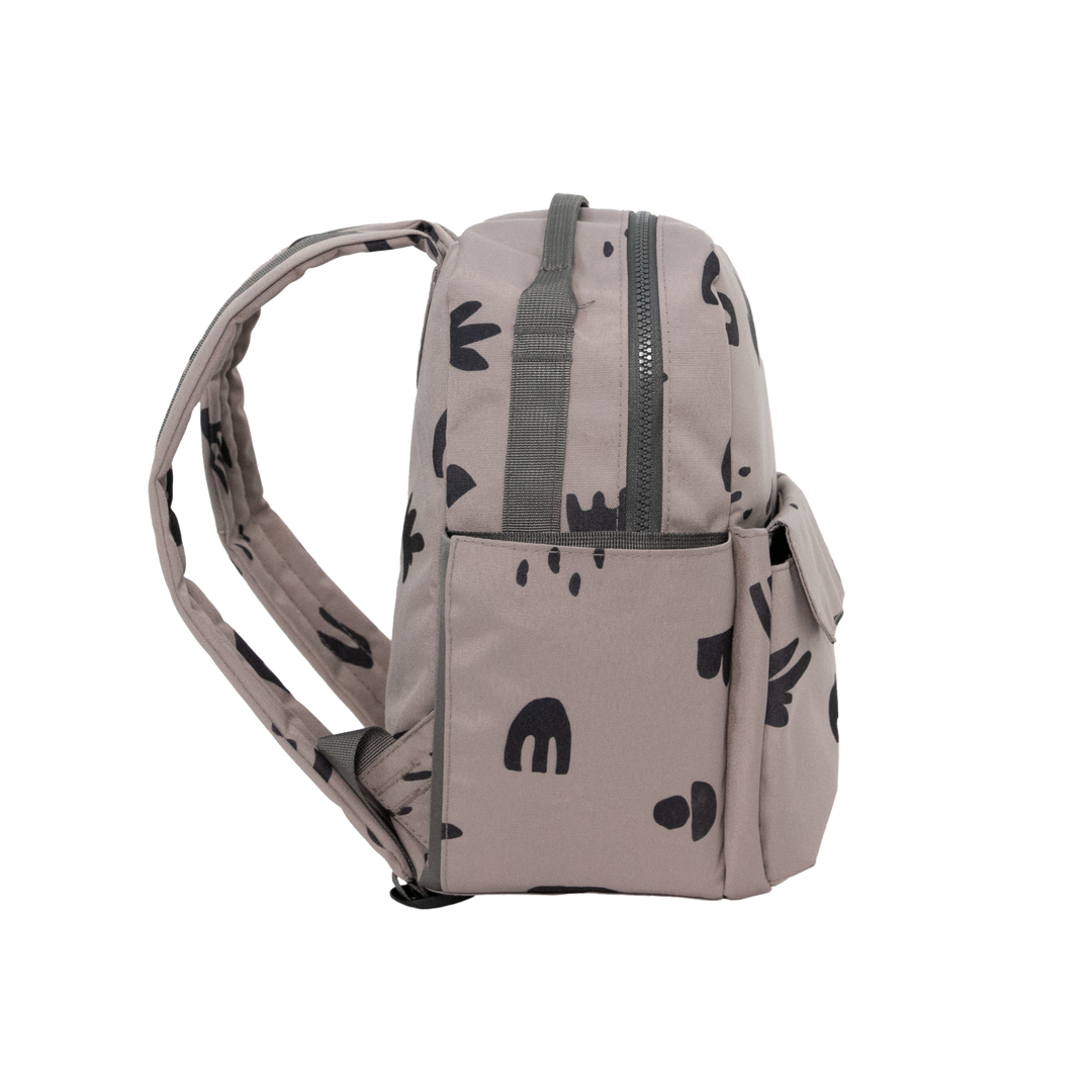 Featuring a fun doodle pattern, the Little Unicorn Red Rovr Mini Roo Backpack in Truffle Doodle adds creativity to kid backpacks.