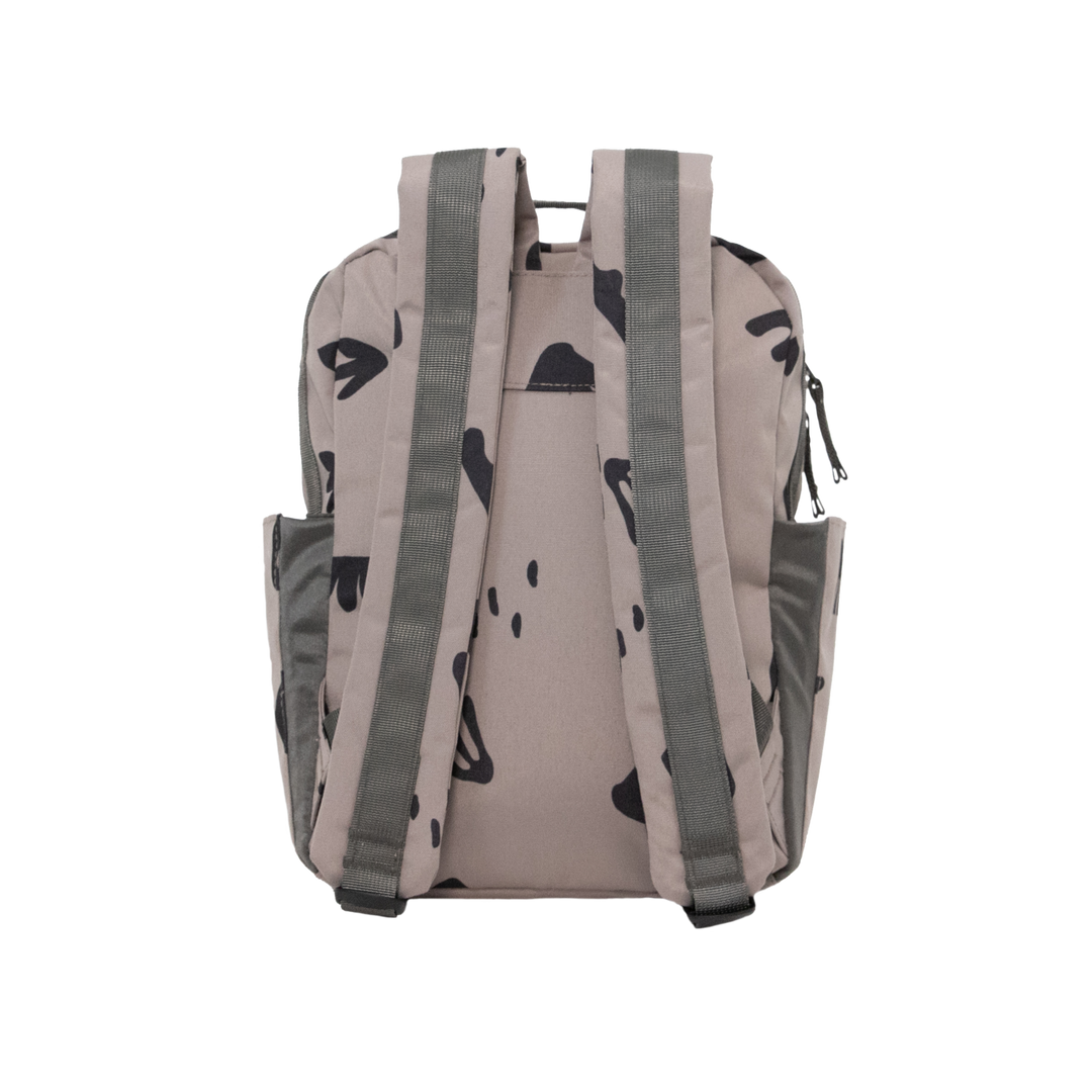 A side profile of the Little Unicorn Red Rovr Mini Roo Backpack - Truffle Doodle, offering practical storage for backpacks for kids.